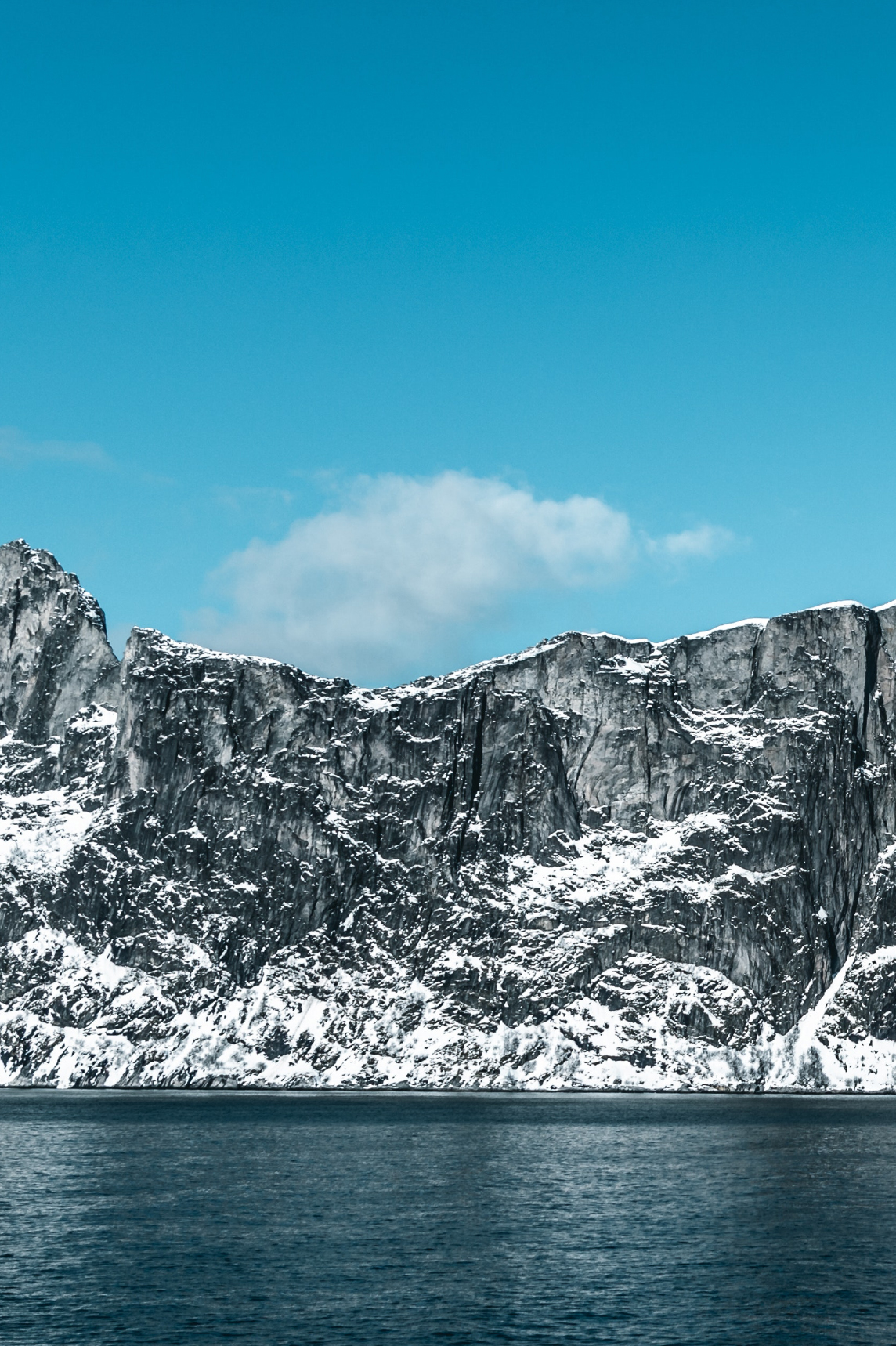 Water, mountains, snow and sky